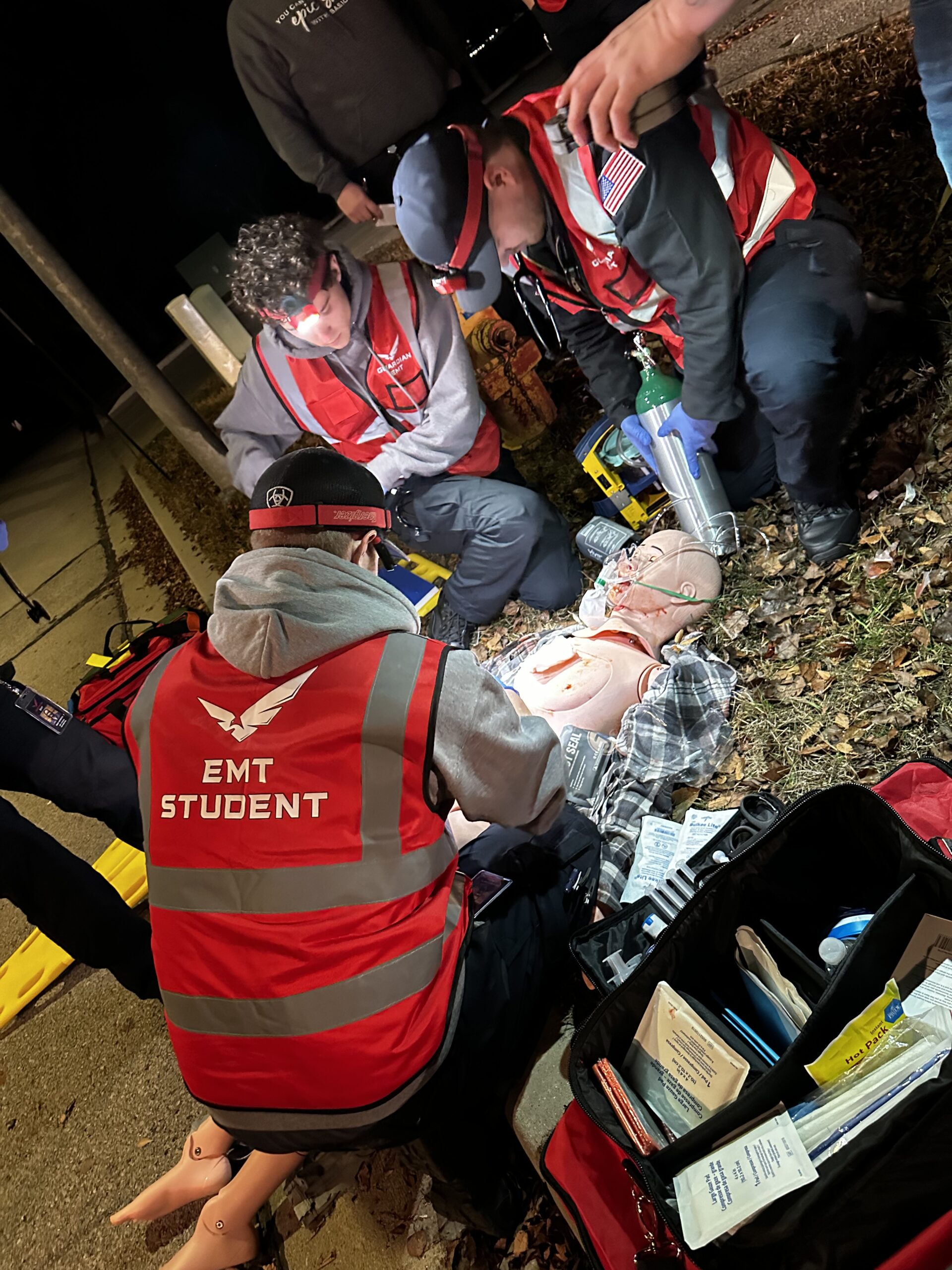 Guardian EMT students performing a parking lot mock code