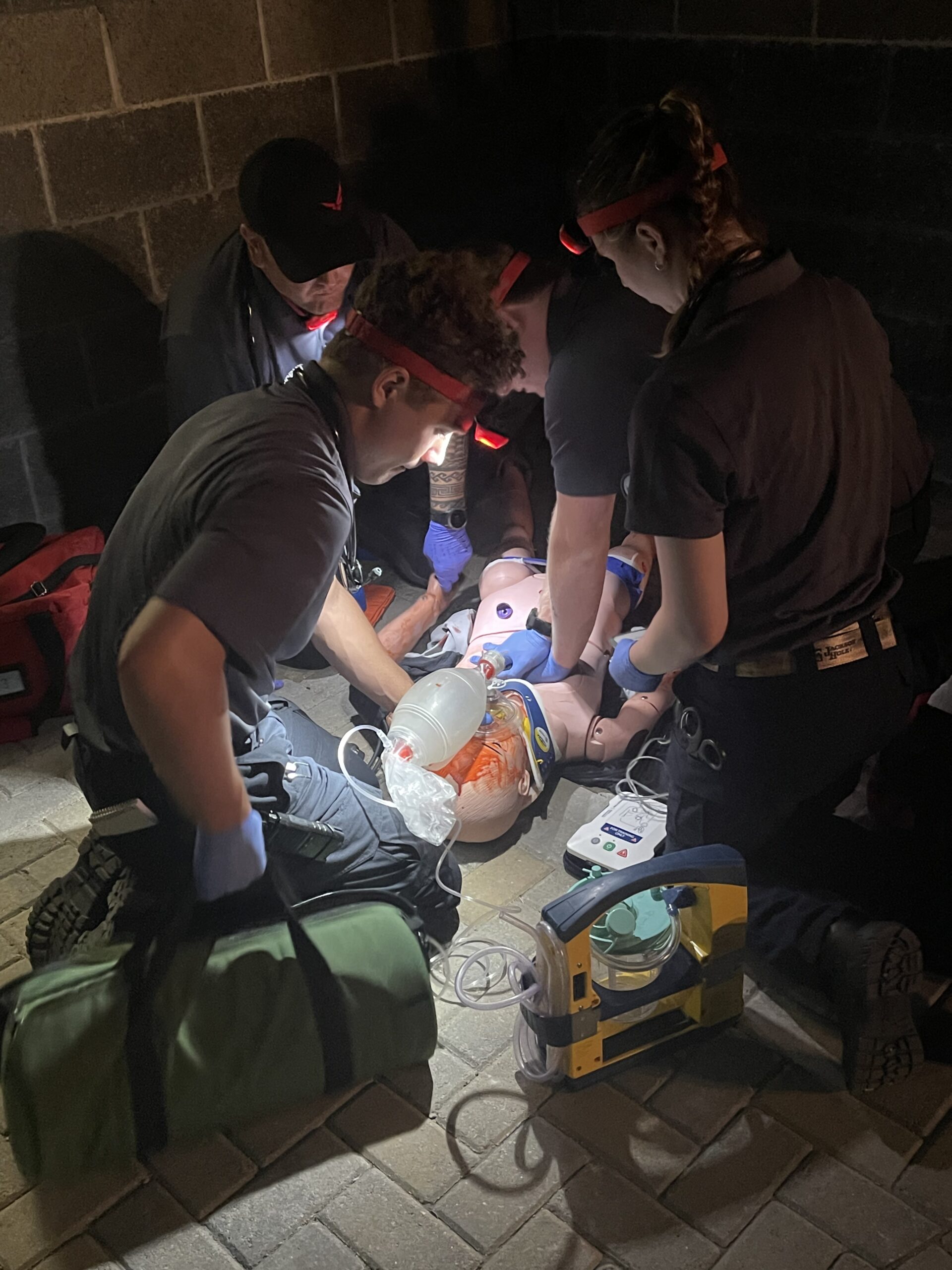 Guardian EMT student practicing advanced airway management with laryngoscope on training manikin
